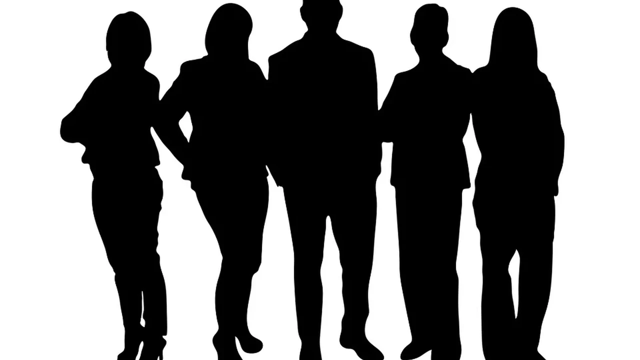 overhead view of corned beef sliced and on a platter with cabbage, potatoes, and carrots