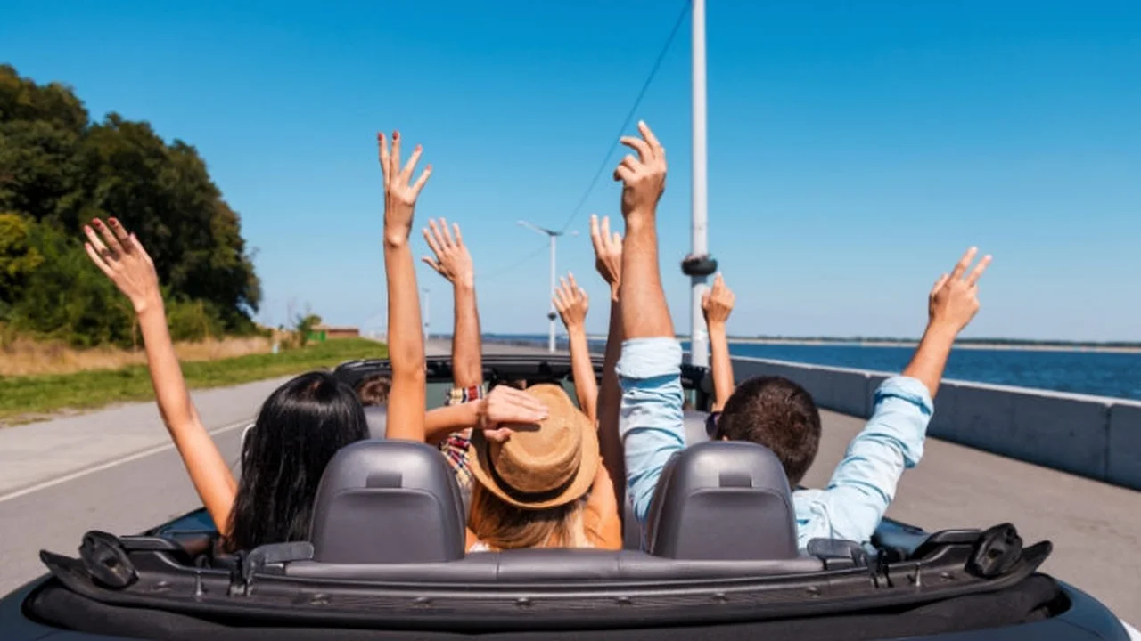 Close up on a plate of mashed potatoes, topped with baked pork chops with cream of mushroom soup, and a side of green beans.